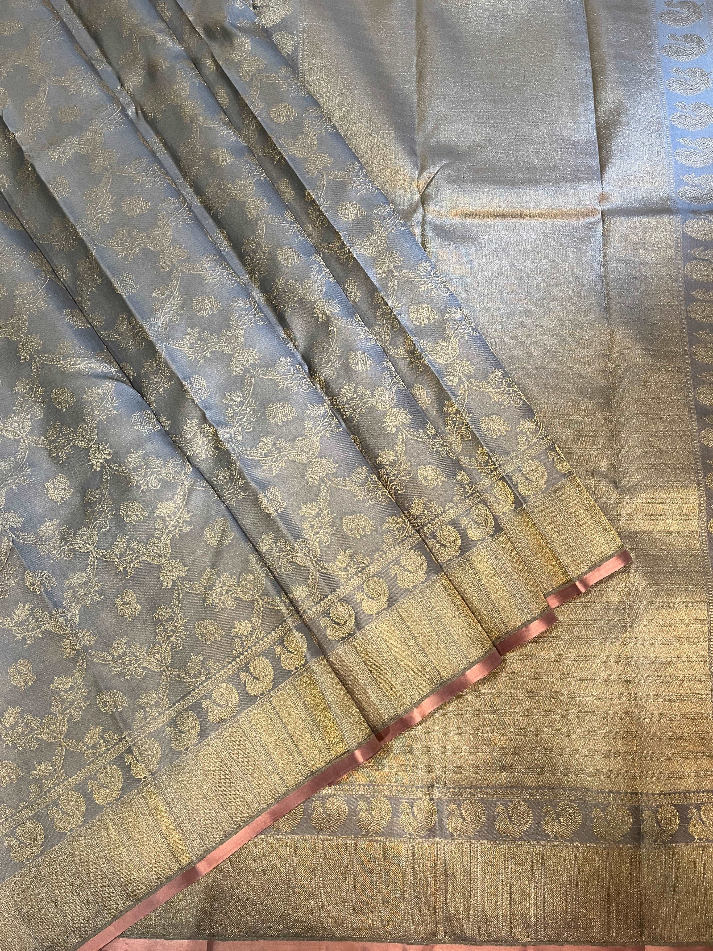 Bavanji border rich and detailed gold zari bavanji pallu on a silver grey Kanchipuram Silk Saree