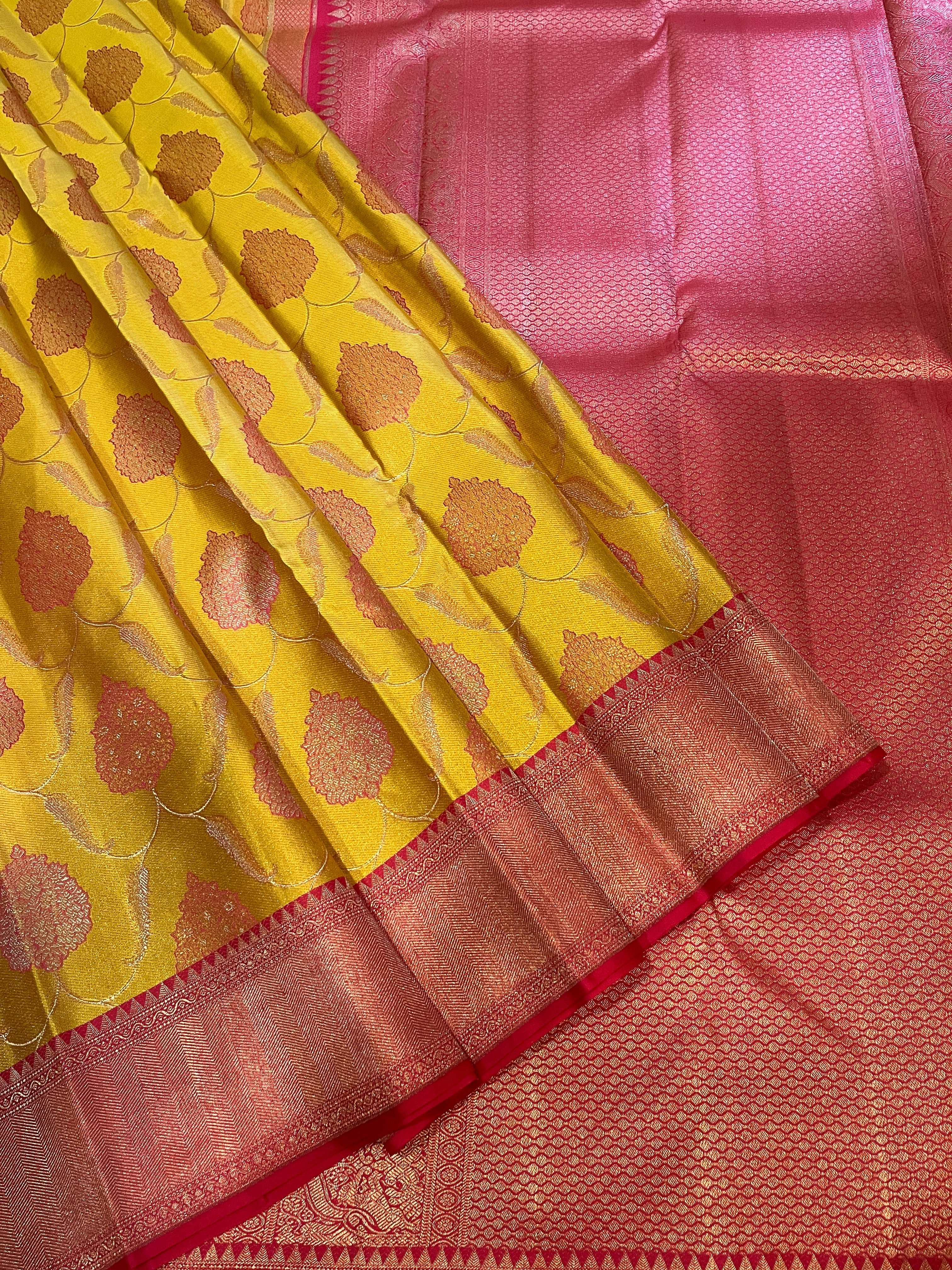 Bavanji border Illuminating yellow with rouge pink floral patterns on a jaali body Kanjivaram silk Saree