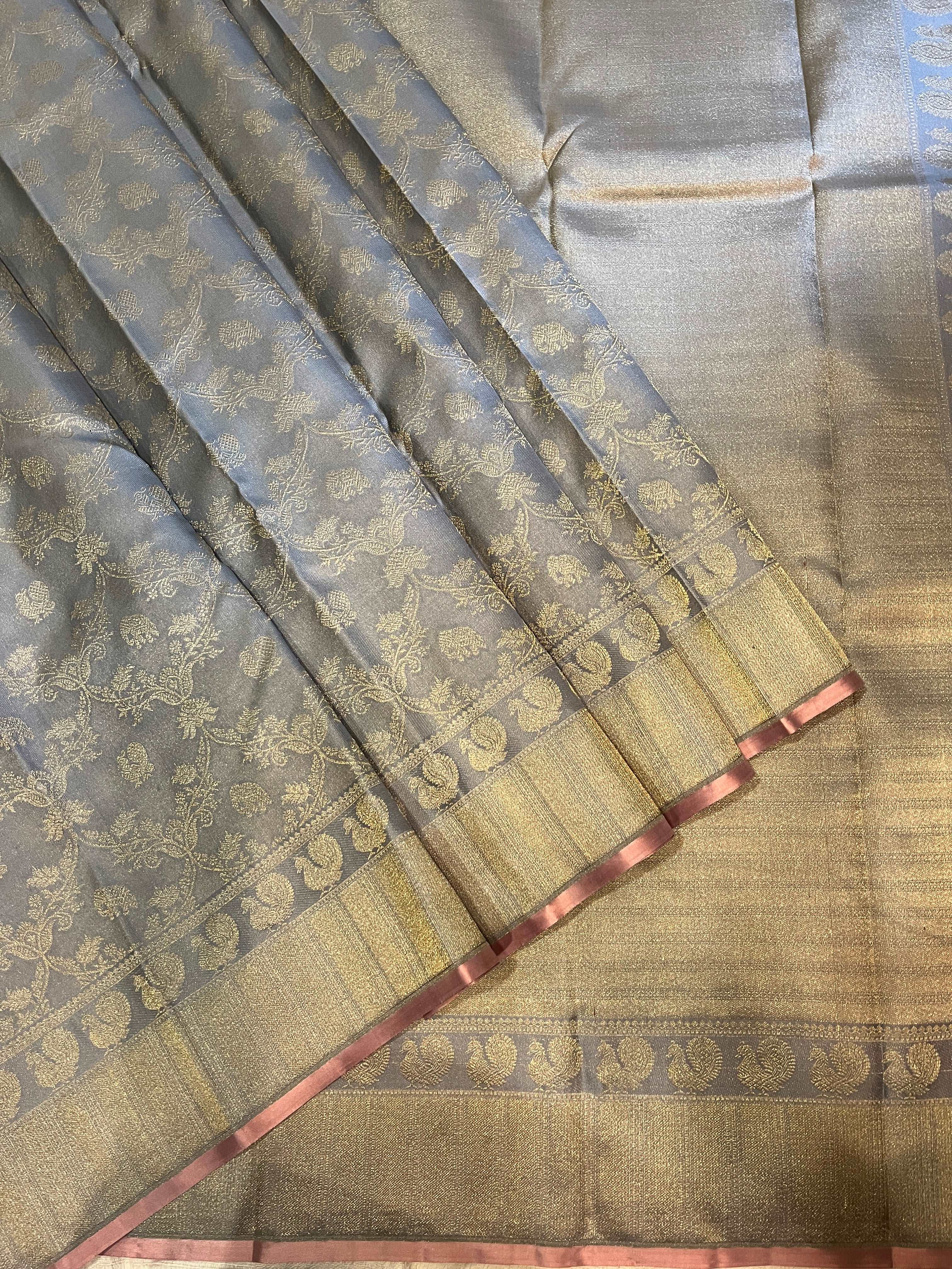 Bavanji border rich and detailed gold zari bavanji pallu on a silver grey Kanchipuram Silk Saree