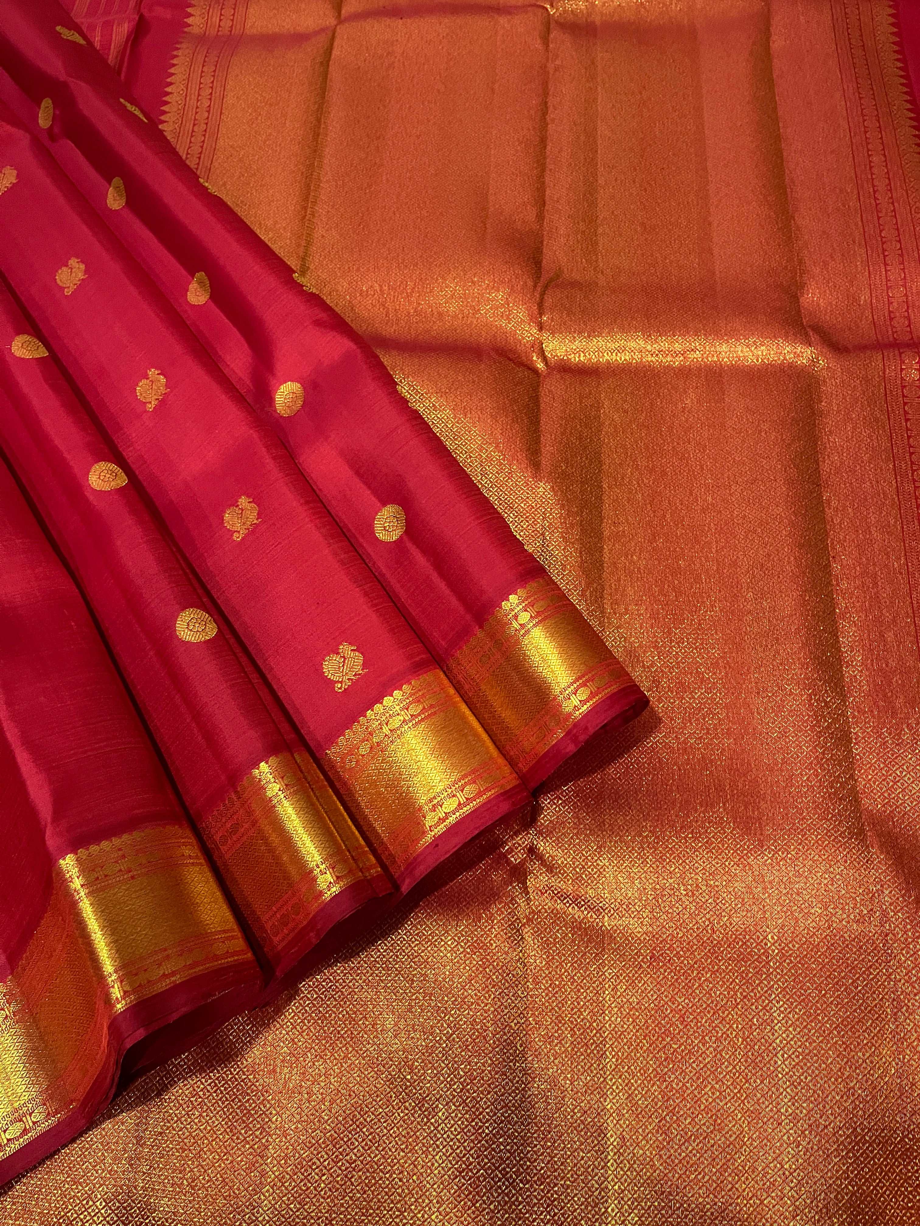 Bavanji border with rudraksh in gold zari Arakka red saree with myil chakram buttas Kanchipuram Silk Saree