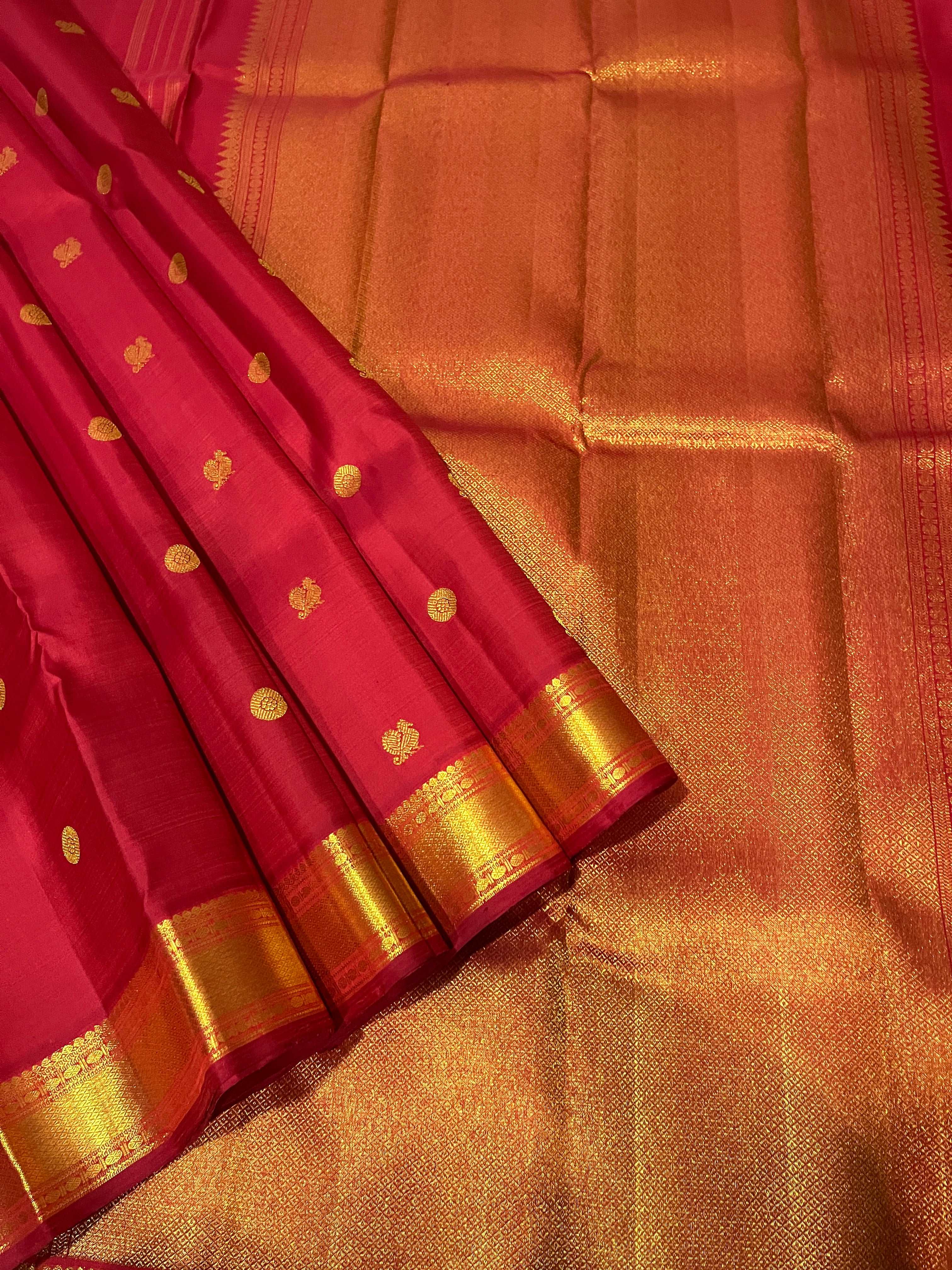 Bavanji border with rudraksh in gold zari Arakka red saree with myil chakram buttas Kanchipuram Silk Saree